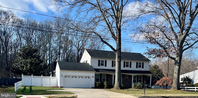 view of front facade featuring a garage and a front lawn