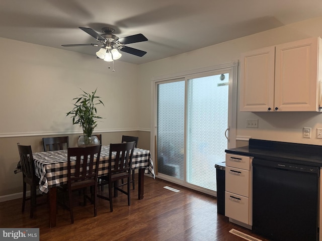 dining space with ceiling fan and dark hardwood / wood-style flooring