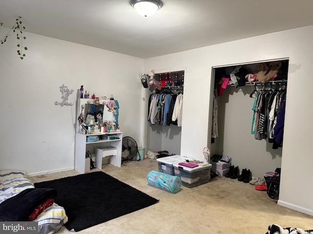 carpeted bedroom featuring a closet