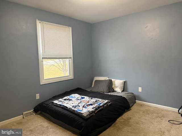 bedroom with light carpet