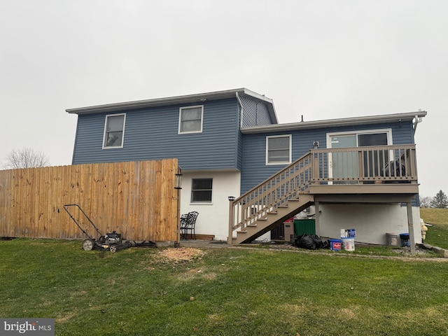 rear view of house with a yard