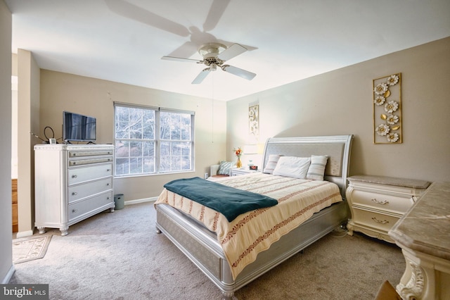 bedroom featuring ceiling fan and light colored carpet