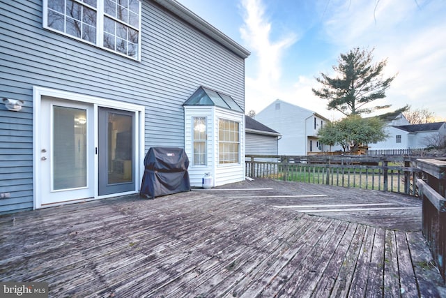 wooden terrace featuring grilling area