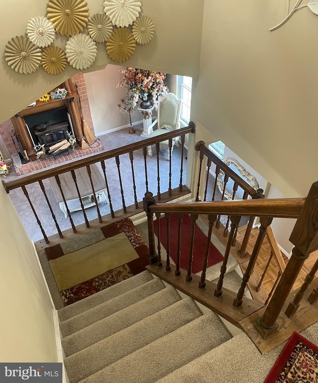 staircase featuring carpet flooring and a towering ceiling