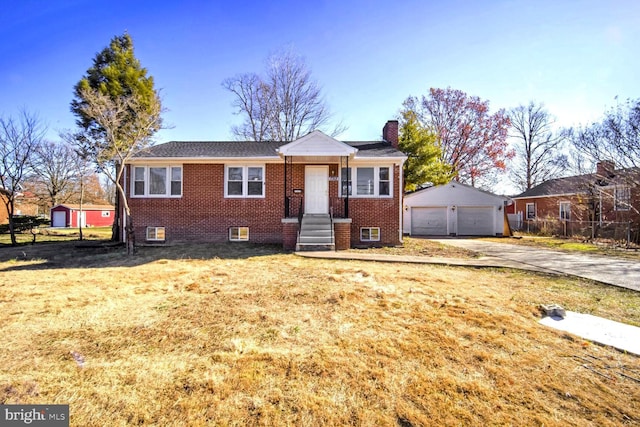 view of front of property featuring a front yard, a garage, and a storage unit