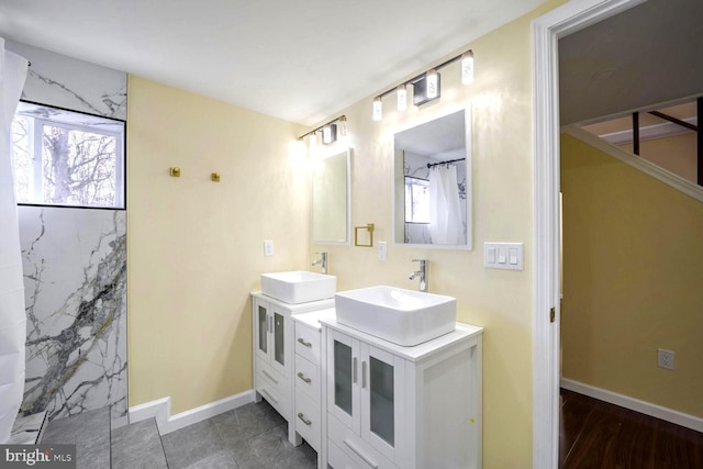 bathroom with vanity, tile patterned floors, and walk in shower