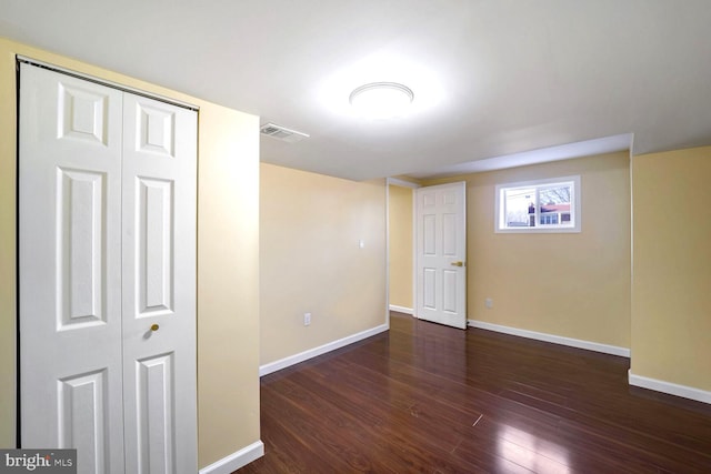 basement with dark wood-type flooring