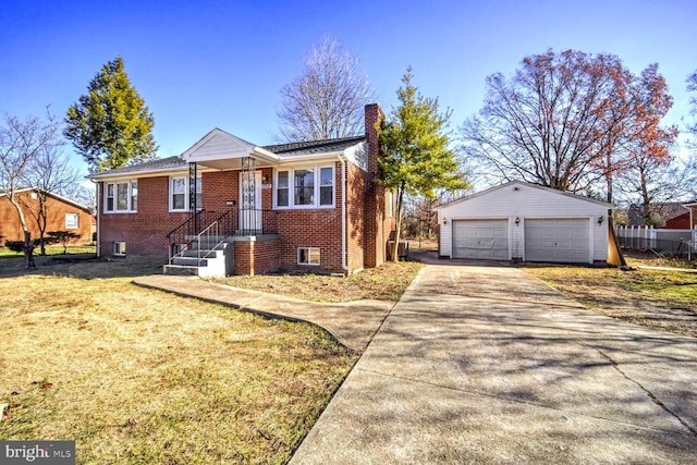 view of front of home with a garage, an outbuilding, and a front lawn