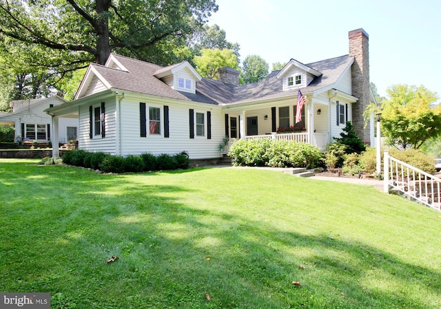 view of front of house with a porch and a front yard