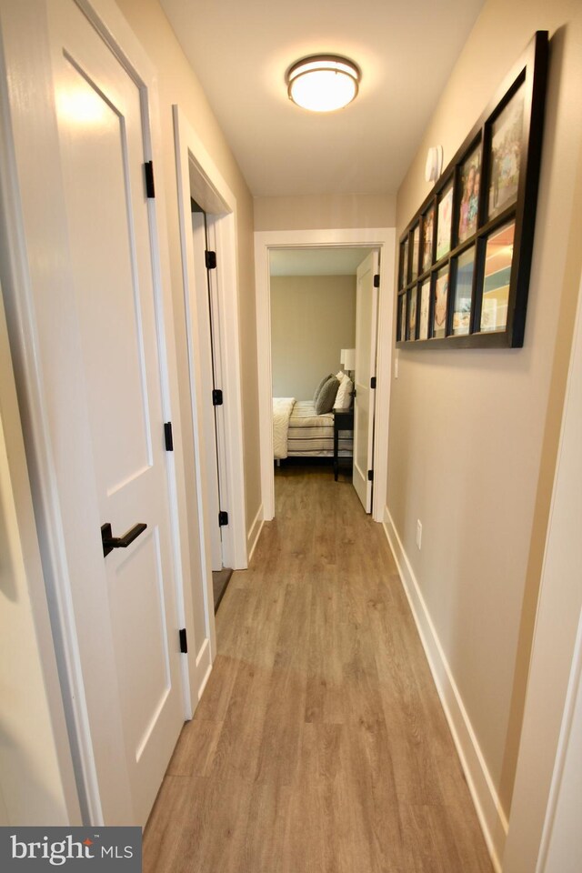 hallway featuring light wood-type flooring