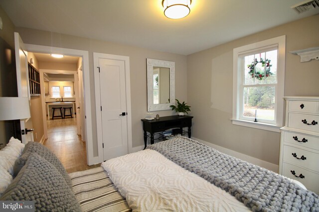 bedroom with light hardwood / wood-style floors