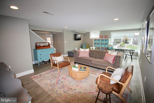 living room with dark hardwood / wood-style floors