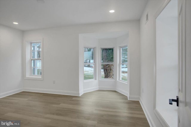 unfurnished room with light hardwood / wood-style flooring