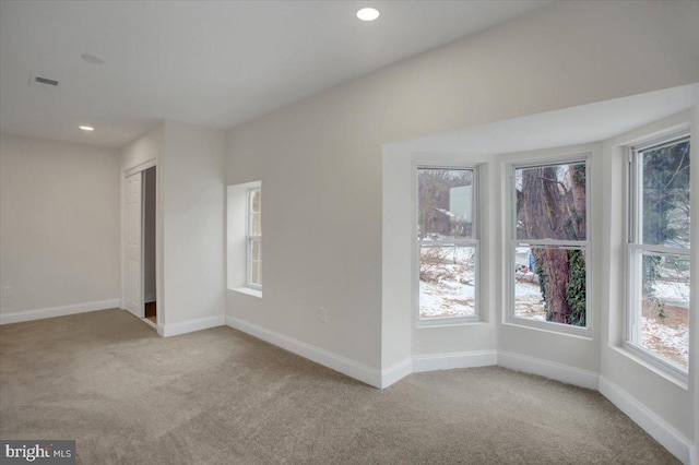 empty room featuring light carpet