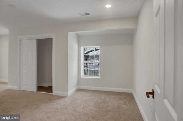 unfurnished bedroom with light carpet