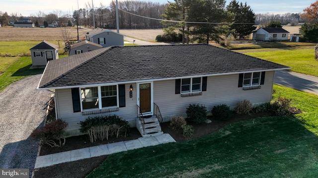 ranch-style house with a front lawn