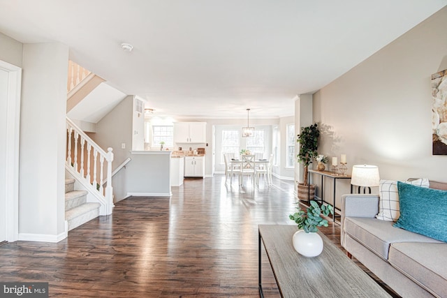 living room with dark hardwood / wood-style floors