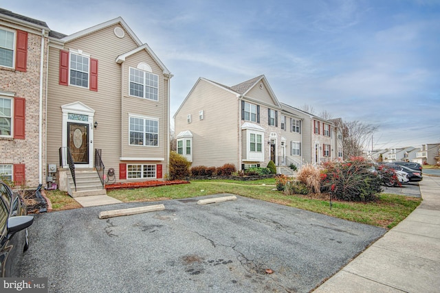 view of property with a front lawn