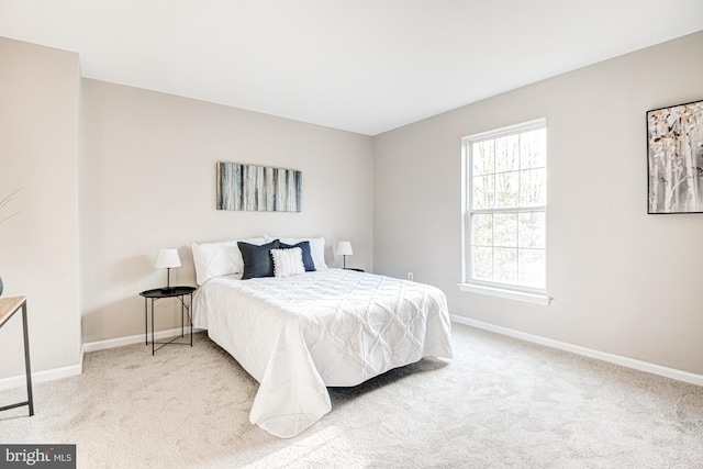 bedroom with light colored carpet