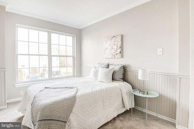 carpeted bedroom featuring multiple windows and ornamental molding