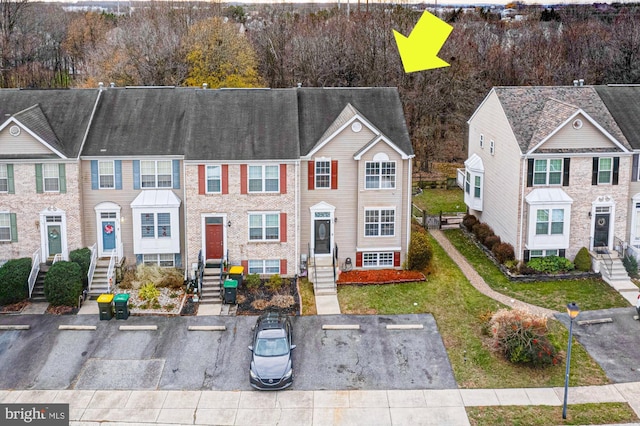 view of property featuring a front yard