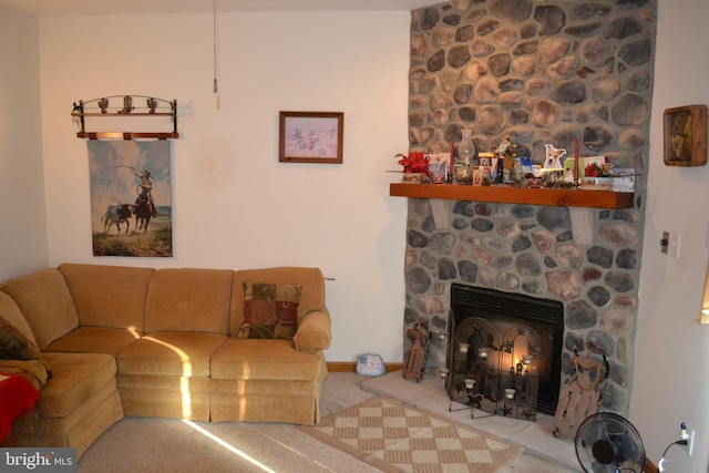 living room featuring a stone fireplace and light colored carpet