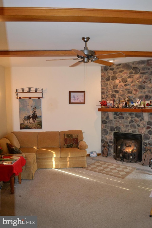 living room with ceiling fan, a fireplace, and carpet floors