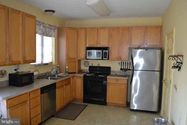 kitchen featuring black appliances and sink