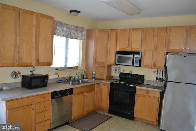 kitchen with sink and black appliances