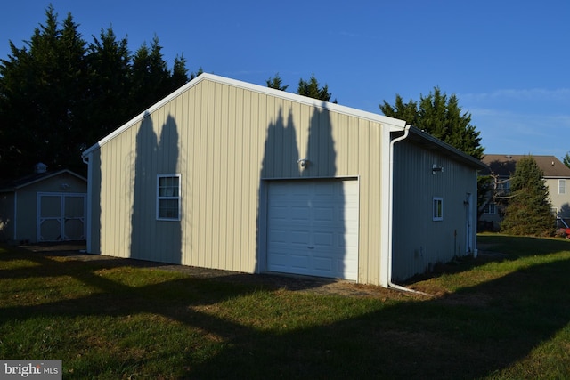 garage with a lawn