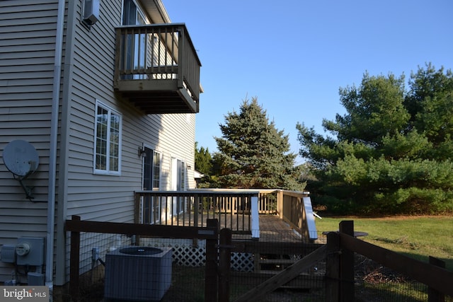 wooden deck featuring central air condition unit