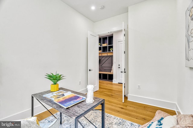 office space with wood-type flooring