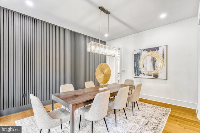 dining space with hardwood / wood-style floors