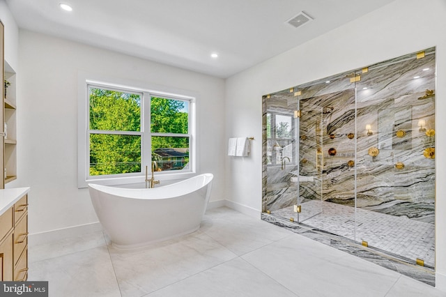 bathroom featuring vanity and separate shower and tub