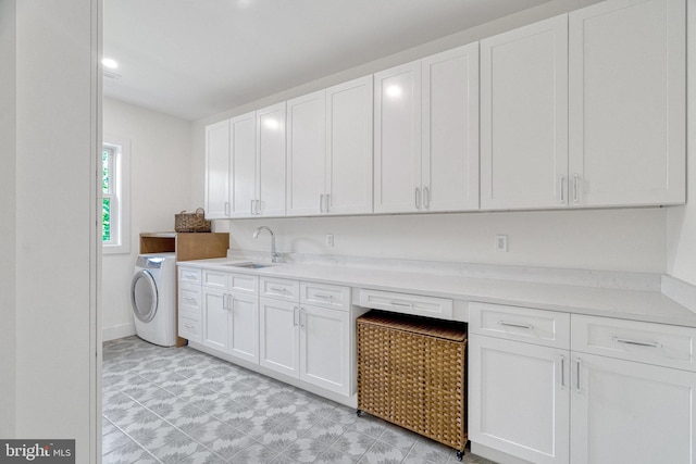 laundry area with washer / dryer and sink