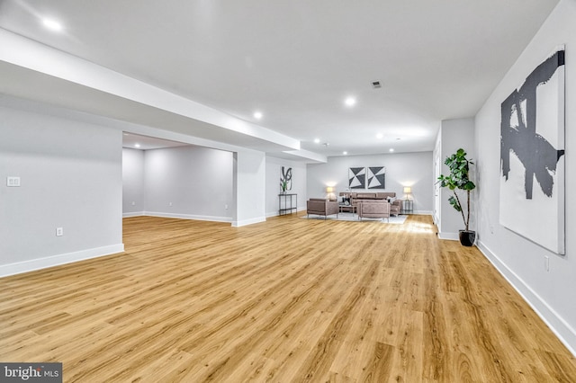 unfurnished living room with light wood-type flooring