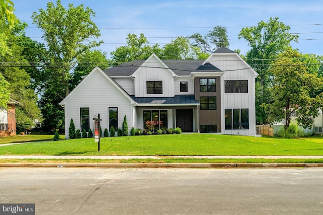 modern farmhouse featuring a front lawn