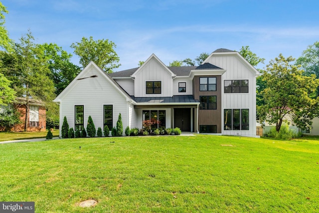 modern inspired farmhouse with a front yard