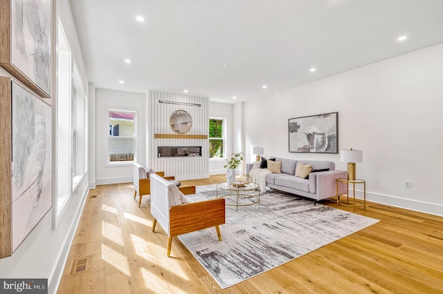 living room with light hardwood / wood-style flooring