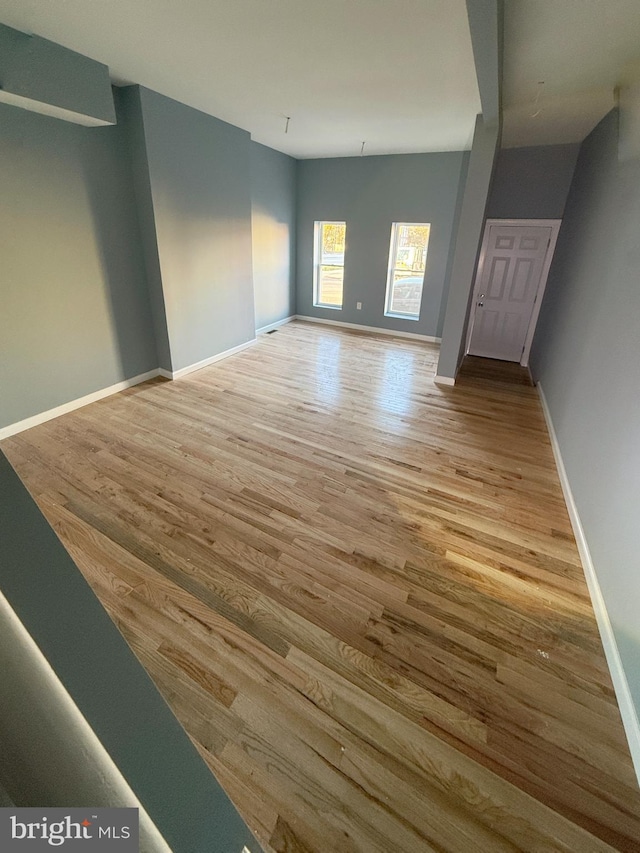 spare room featuring light hardwood / wood-style flooring