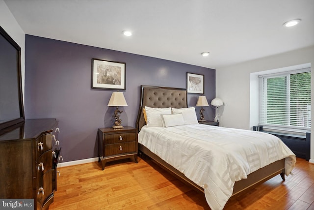 bedroom with light wood-type flooring