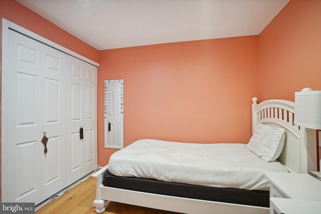 bedroom featuring hardwood / wood-style flooring and a closet