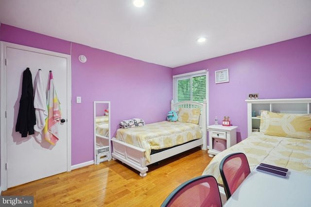 bedroom with hardwood / wood-style floors