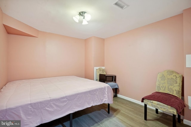 bedroom featuring wood-type flooring