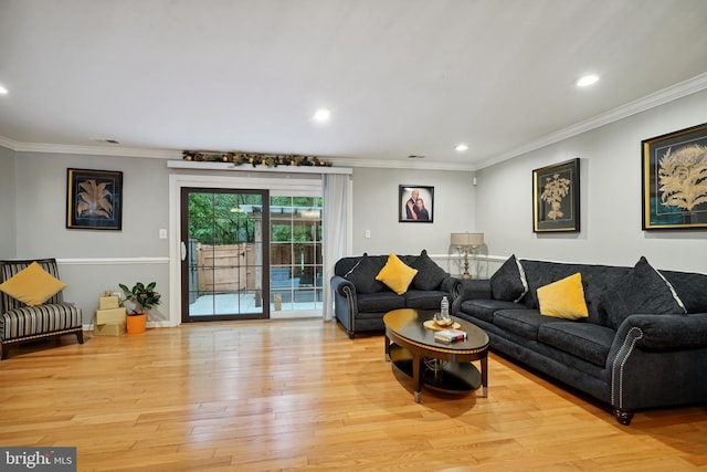 living room with light hardwood / wood-style floors and ornamental molding