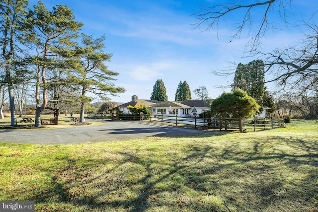 exterior space with a front lawn