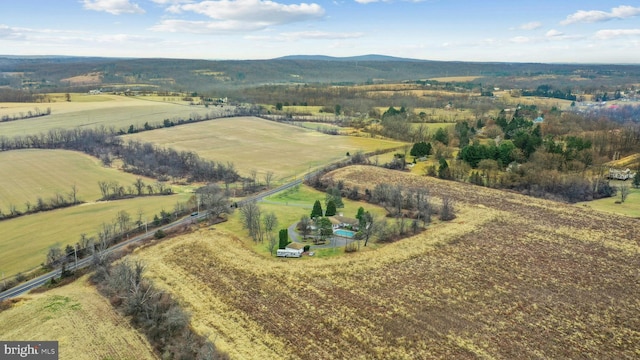 drone / aerial view featuring a mountain view and a rural view