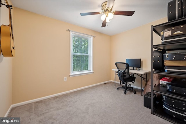 office space featuring ceiling fan and light colored carpet