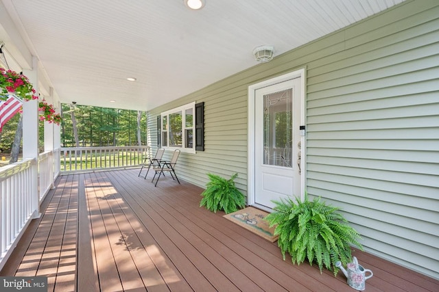 wooden deck featuring covered porch