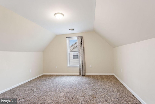 bonus room with carpet and lofted ceiling